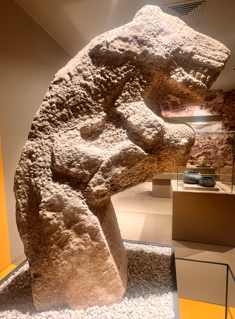 A Karahan Tepe sculpture of a man carrying a leopard on his back — the usual arrangement of the motif