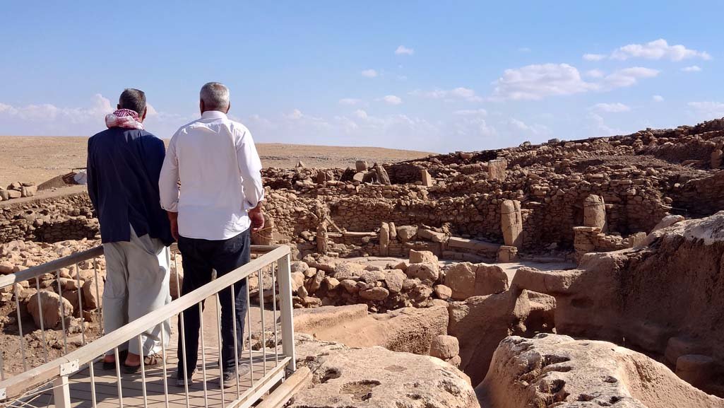 Rock-cut chambers and standing pillars at Karahan Tepe. Its Pre-Pottery Neolithic date &mdash; more than 11,000 years ago &mdash; is established by material culture and by comparison with radiocarbon-dated Göbekli Tepe.