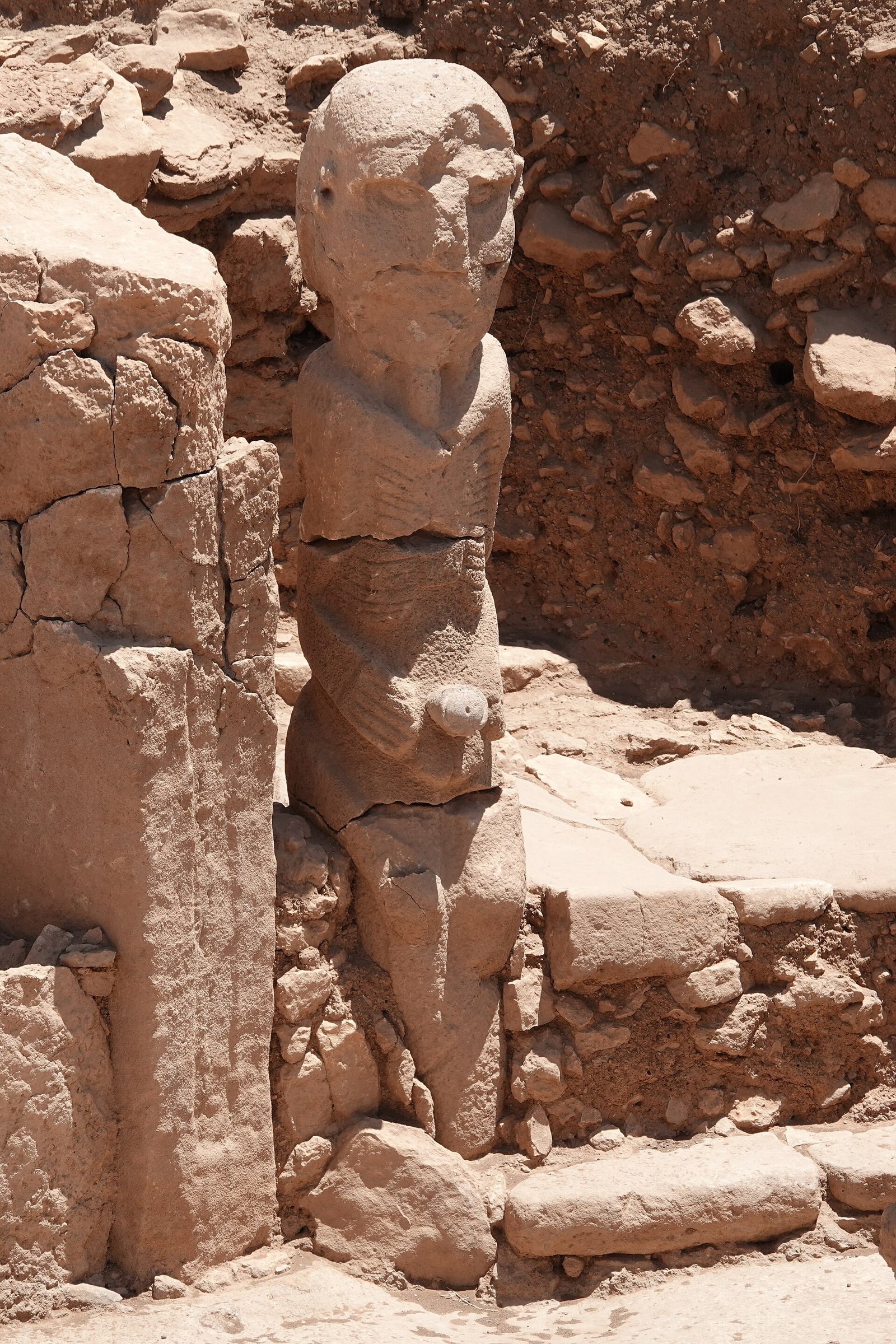 A carved anthropomorphic pillar-figure with arms and hands at Karahan Tepe