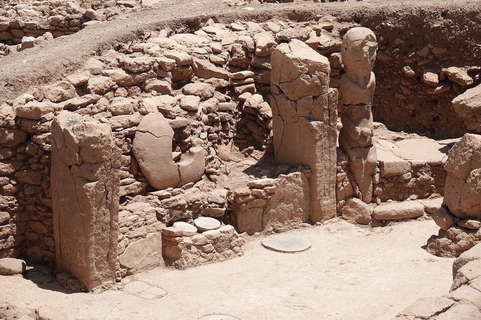 A rock-cut building with standing pillars at Karahan Tepe