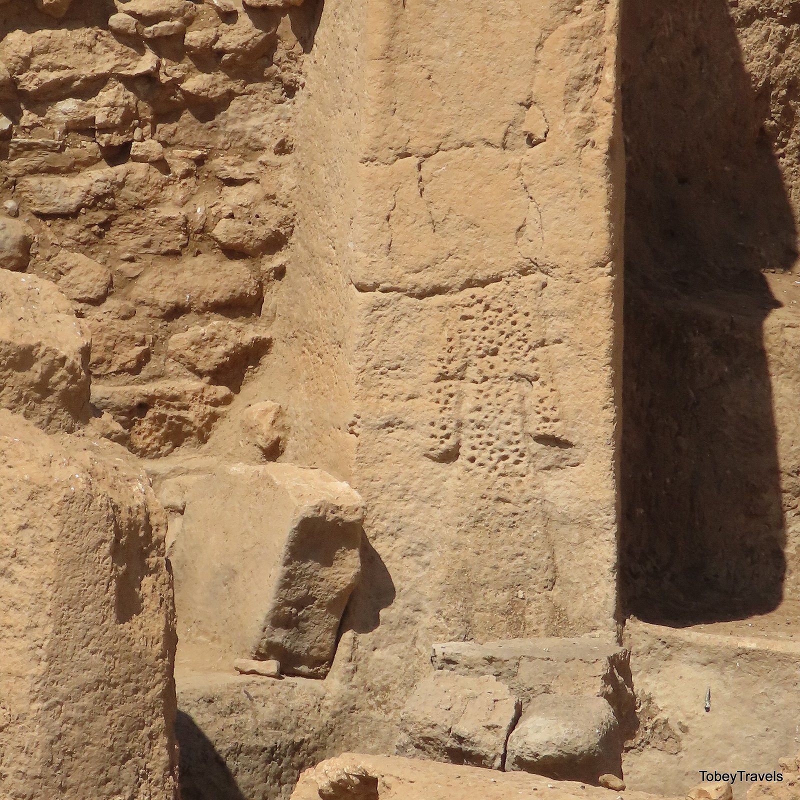 A carved human figure on a pillar of the Central Building (Structure AD)