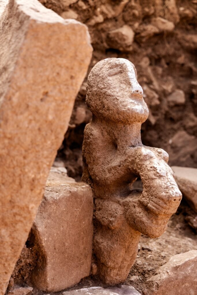Close view of the 2026 Karahan Tepe sculpture joining a human figure and a leopard into one composition